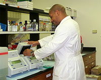 Byron using a polymerase chain reaction (PCR) machine