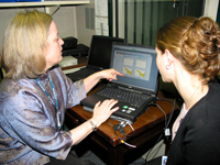 Univeristy of Maryland student, Erin McAlister, reviews data from an acoustic reflectance test with her mentor Carmen Brewer.