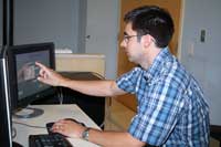 Chris uses a unique software program to set up data points that the infrared cameras will collect during a patient visit.