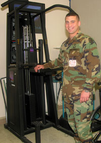 Chris Weaver demonstrates the use of a Graviton used for strength training.