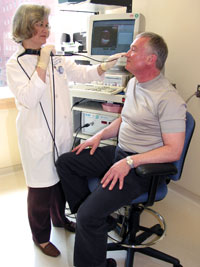 Christy Ludlow uses a video strobe monitor, which allows her to view muscle movements in the larynx.