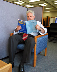 Dr. George reading a medical science journal to stay up-to-date.
