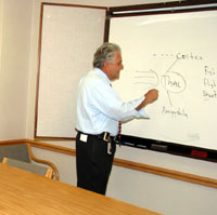 Dr. George illustrates scientific ideas to colleagues.