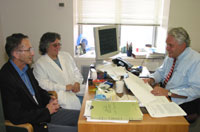 Dr. George discussing research results.