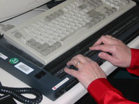 Debby Hill uses a PowerBraille display. It provides braille output from the computer.