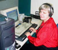 Debby Hilll working at her desk.