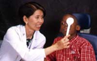 Dr. Chew performs a simple cover test to observe the behavior of the patient’s uncovered eye as it fixates on a distant target.
