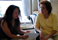 Faith collaborates with other scientists on several projects, and as seen here, discusses a recent experiment with a colleague in her lab.