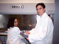 Greg Tate evaluates work practices and recommends procedures involving a biosafety cabinet (sterile environment for biological research).