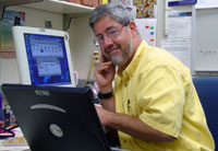 Jack Simpson performs administrative tasks at his desk.