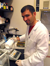 Jason weighs out chemicals to be used in an experiment