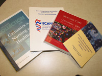 A small sampling of Jean Jenkin’s publications are displayed, each representing some of her significant contributions to genomics and genetics education for healthcare professionals.