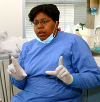 Dr. Cyriaque in the clinic seeing patients.