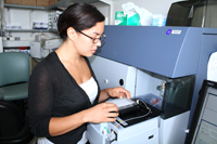 Jennifer uses a machine to perform flow cytometry, which is a method to differentiate the types of immune cells in a culture.