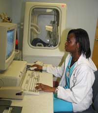 Kevilin uses the Pulmonary Function Testing Machine (or Body Box) which is a pressurized chamber used to  measure the amount of air in a patient's lungs during different stages of respiration.