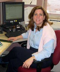 Tanya B. at her desk working on administrative tasks.