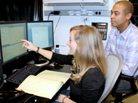 Zayd plays the role of mentor in his laboratory, and plans and discusses experiments with his mentee.