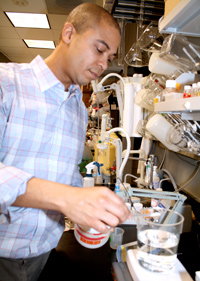 Zayd prepares a solution for his experiments that mimics cerebrospinal fluid (the fluid in and around the brain and spinal cord).